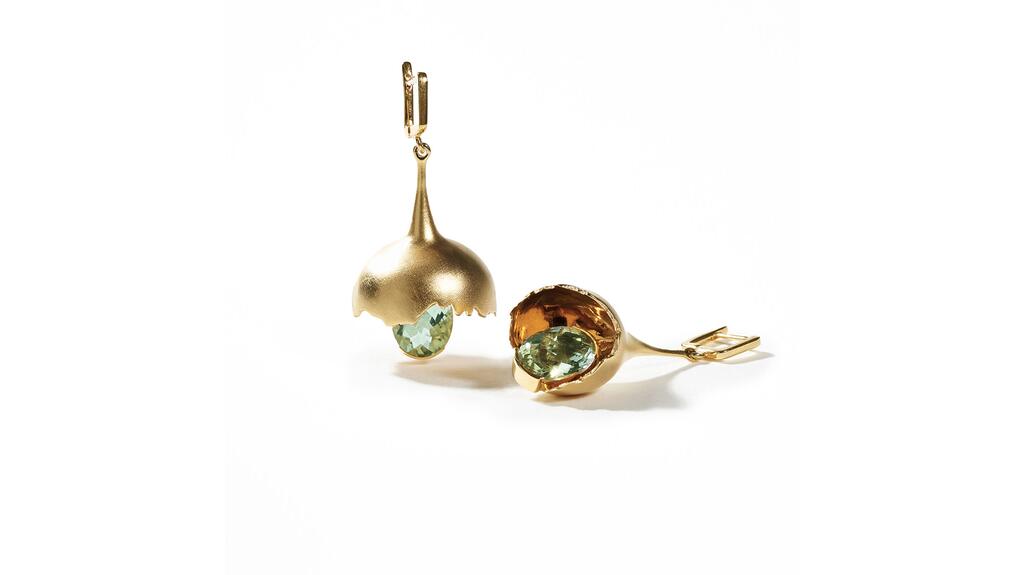 German Kabirski in Lake Worth, Florida, designed by German Kabirski. A pair of earrings in sterling silver with 18-karat yellow gold plating shaped as cracked-in-half spheres with dangling green amethysts ($670) German Kabirski Earrings